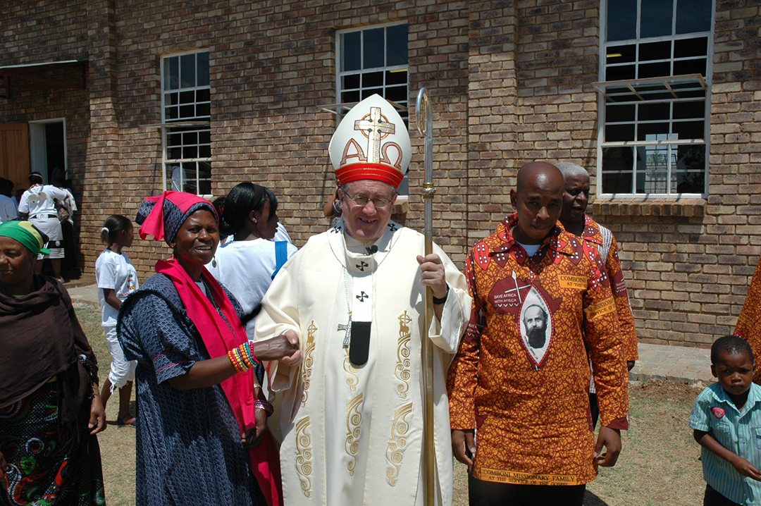 Archbishop of Pretoria, William Slattery, with two parishioners of Saint Daniel Comboni Parish, Mahube Valley, Mamelodi, during Confirmations. Credit: Jame Calvera MCCJ.